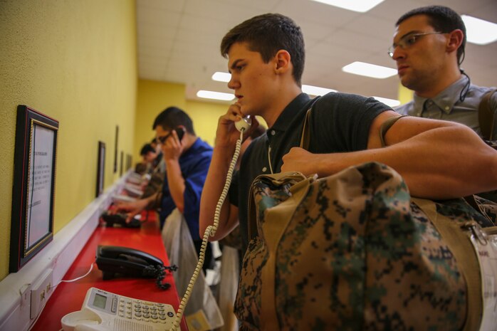A recruit of Echo Company, 2nd Recruit Training Battalion, makes his phone call home, reading only what is printed on the script in front of him, during receiving at Marine Corps Recruit Depot San Diego, Dec. 7. Recruits will not be able to make another phone call until the end of recruit training. Today, all males recruited from west of the Mississippi are trained at MCRD San Diego. The depot is responsible for training more than 16,000 recruits annually. Echo Company is scheduled to graduate March 4.
