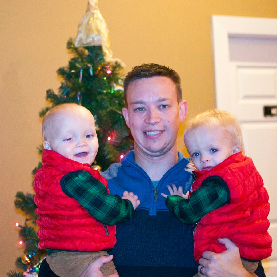 Capt. Ryan Shrout, Marine Corps Combat Development Command deputy staff judge advocate, and his 18-month-old twin boys attend the EFMP Christmas party.