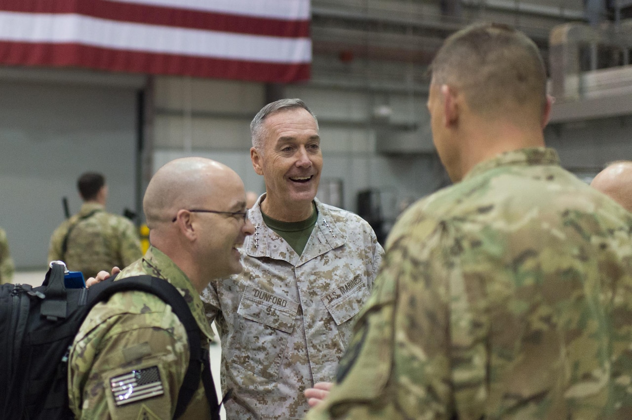 U.S. Marine Corps Gen. Joseph F. Dunford Jr., chairman of the Joint Chiefs of Staff, talks with U.S. service members after a USO show at Bagram Airfield, Afghanistan, Dec. 8, 2015. Dunford was traveling along with entertainers from the 2015 USO Holiday Tour to visit deployed service members. DoD photo by D. Myles Cullen