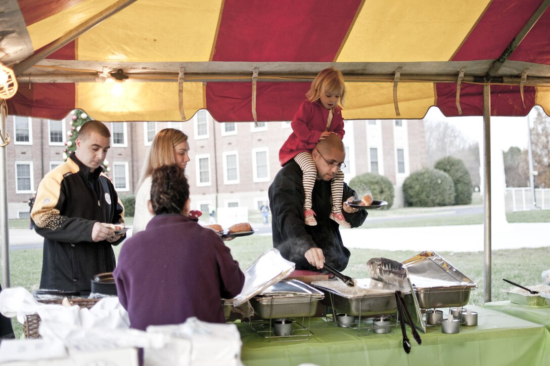 Families are served hotdogs and warm pretzels during the Fifth Annual Base Christmas Tree Lighting Ceremony aboard Marine Corps Base Quantico Dec. 6.