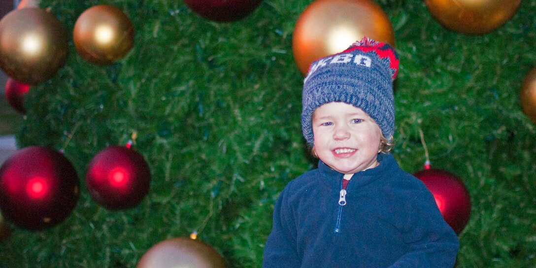 A military child attends the Fifth Annual Base Christmas Tree Lighting Ceremony at Lejeune Hall Dec. 6 aboard Marine Corps Base Quantico. The 25-foot-tree was lit by Col. Joseph Murray, base commander.