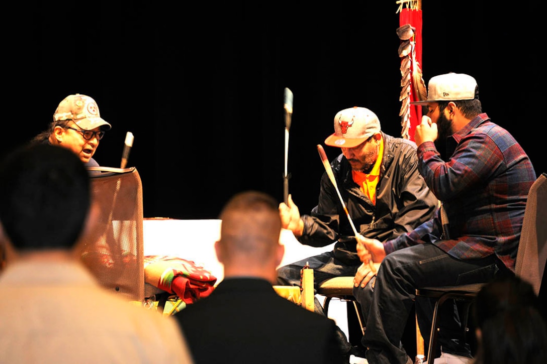 Tribal veterans from the Nottawasippi Huron Band of Potawatomi perform a “Welcome Song” and a “Veterans Song.” Photo by Jace Armstrong