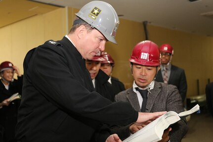 CAMP ZAMA, Japan (Dec 10, 2015) -  Col. William B. Johnson, commander of U.S. Army Garrison Japan, asks questions about the facilities during the tour of Zama General Hospital, currently under construction. 