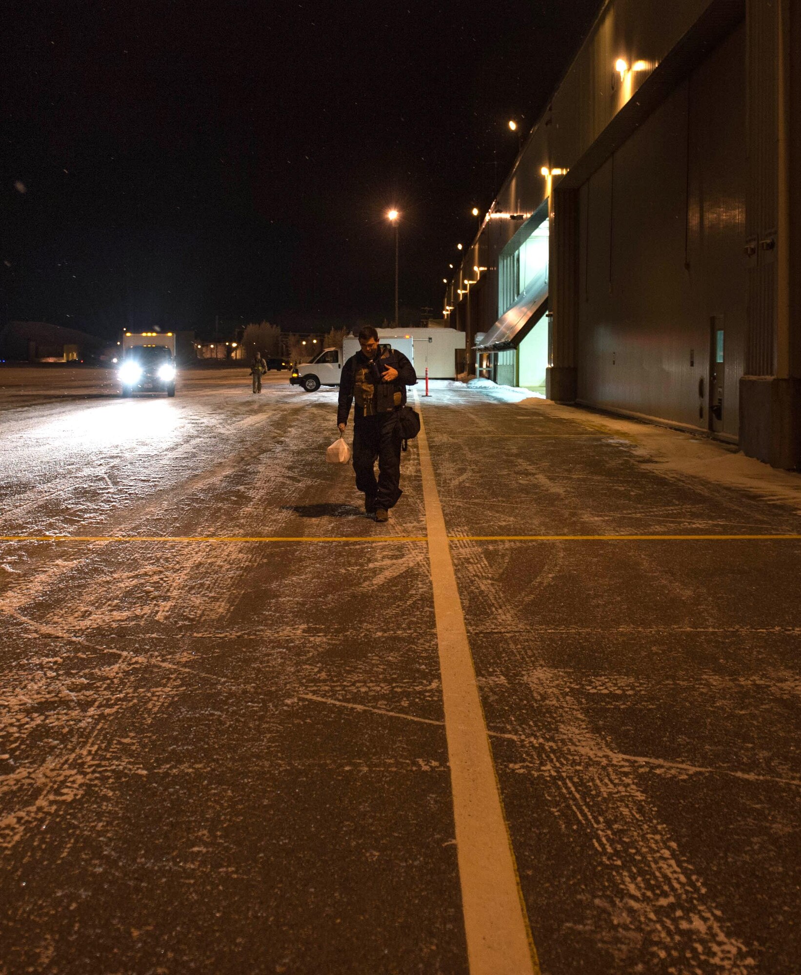 Air Force Maj. Joseph Howard, an 18th Aggressor Squadron pilot, “steps” to his F-16 Fighting Falcon fighter aircraft at Dec. 7, 2015, at Eielson Air Force Base, Alaska. Howard and several other pilots were flying to Tyndall Air Force Base, Florida, for CHECKERED FLAG 16-1, a large-force exercise that simulates a large number of aircraft in a deployed environment to cross-check weapons systems. (U.S. Air Force photo by Staff Sgt. Shawn Nickel/Released)