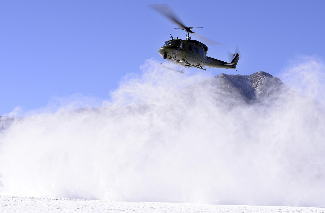 A UH-1N Huey from the 37th Helicopter Squadron at F.E. Warren Air Force Base, Wyo., lands at the U.S. Air Force Academy's preparatory school in Colorado Springs, Colo., Nov. 30, 2015. The helicopter and crew familiarized cadet candidates with the aircraft and its mission. (U.S. Air Force photo/Mike Kaplan)