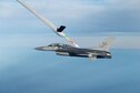 An F-16 Fighting Falcon from the 416th Flight Test Squadron at Edwards Air Force Base, Calif., is in the process of a midair fuel transfer from a Royal Australian Air Force KC-30A tanker Dec. 3, 2015. This was the first flight as part of a coalition tanker aerial refueling certification effort to qualify Australian, United Arab Emirates and Italian tankers to refuel U.S. Air Force F-16s, F-15 Eagles, B-1B Lancers, and A-10 Thunderbolt IIs using their respective booms. The test team will check for qualities such as fuel pressure surges, stability of the aircraft being refueled and the handling qualities of the boom for certification. (U.S. Air Force photo/Christian Turner)