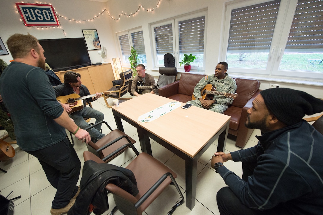 USO entertainers play music with soldiers at a USO center at Landstuhl Regional Medical Center, Germany, Dec. 9, 2015. DoD photo by D. Myles Cullen