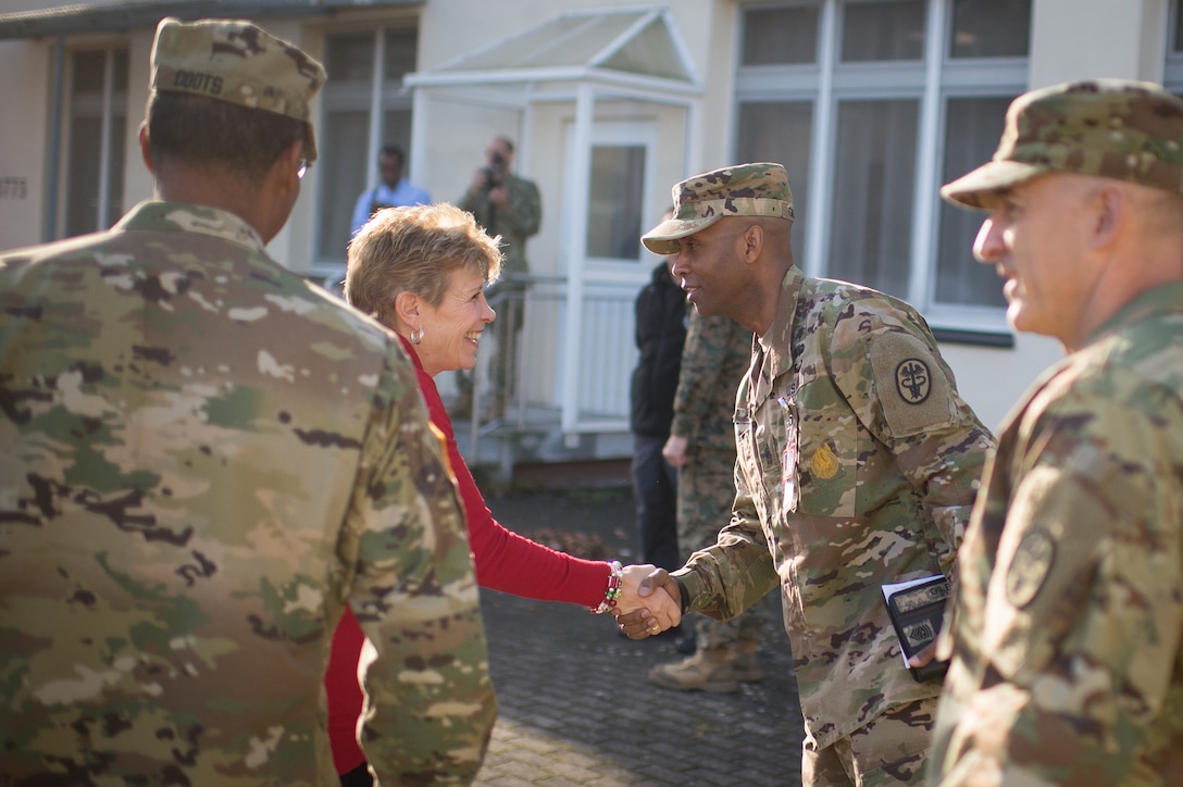 Ellyn Dunford, wife of U.S. Marine Corps Gen. Joseph F. Dunford Jr., chairman of the Joint Chiefs of Staff, is greeted by Command Sergeant Major Antez Gilbert at Landstuhl Regional Medical Center, Germany, Dec. 9, 2015. DoD photo by D. Myles Cullen