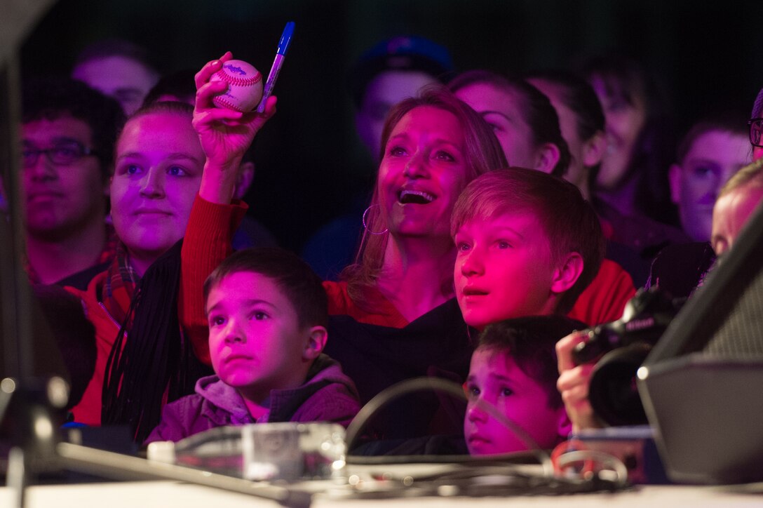The audience enjoys the USO show for military members and their families at Ramstein Air Base, Germany, Dec. 9, 2015. Entertainers with the 2015 USO Holiday Tour traveled to various locations to visit service members deployed overseas. DoD photo by D. Myles Cullen