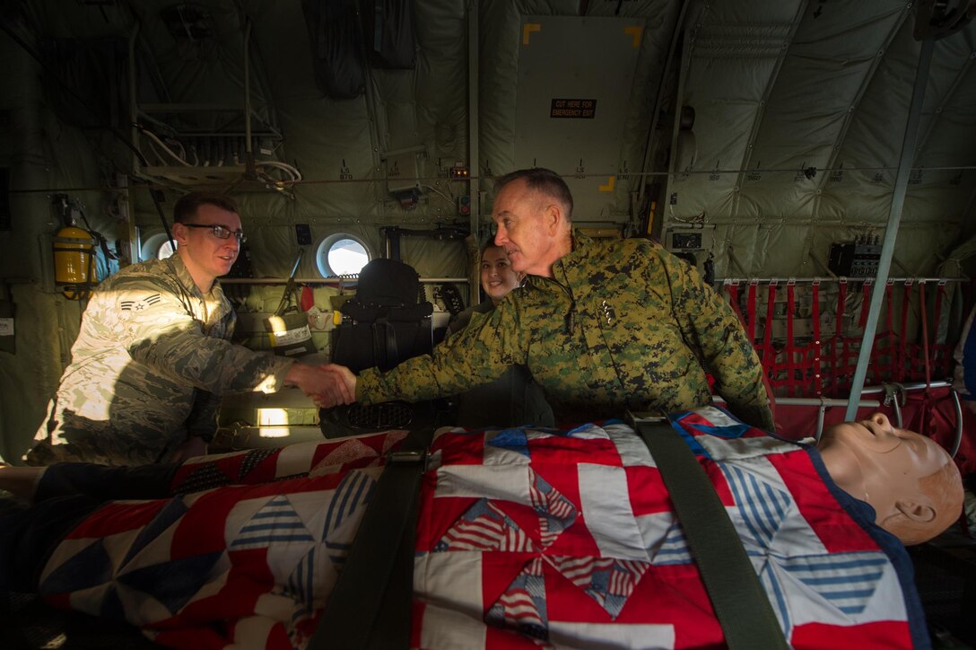 U.S. Marine Corps Gen. Joseph F. Dunford Jr., chairman of the Joint Chiefs of Staff, talks  with airmen stationed on Ramstein Air Base, Germany, Dec. 9, 2015. Dunford and entertainers with the 2015 USO Holiday Tour traveled to various locations to visit service members deployed overseas. DoD photo by D. Myles Cullen