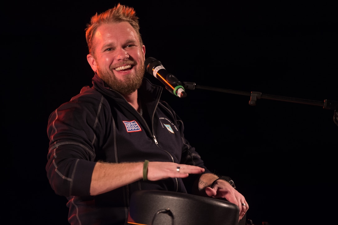 Songwriter Kyle Jacobs performs in a USO show for military members and their families at Ramstein Air Base, Germany, Dec. 9, 2015. Entertainers with the 2015 USO Holiday Tour traveled to various locations to visit service members deployed overseas. DoD photo by D. Myles Cullen