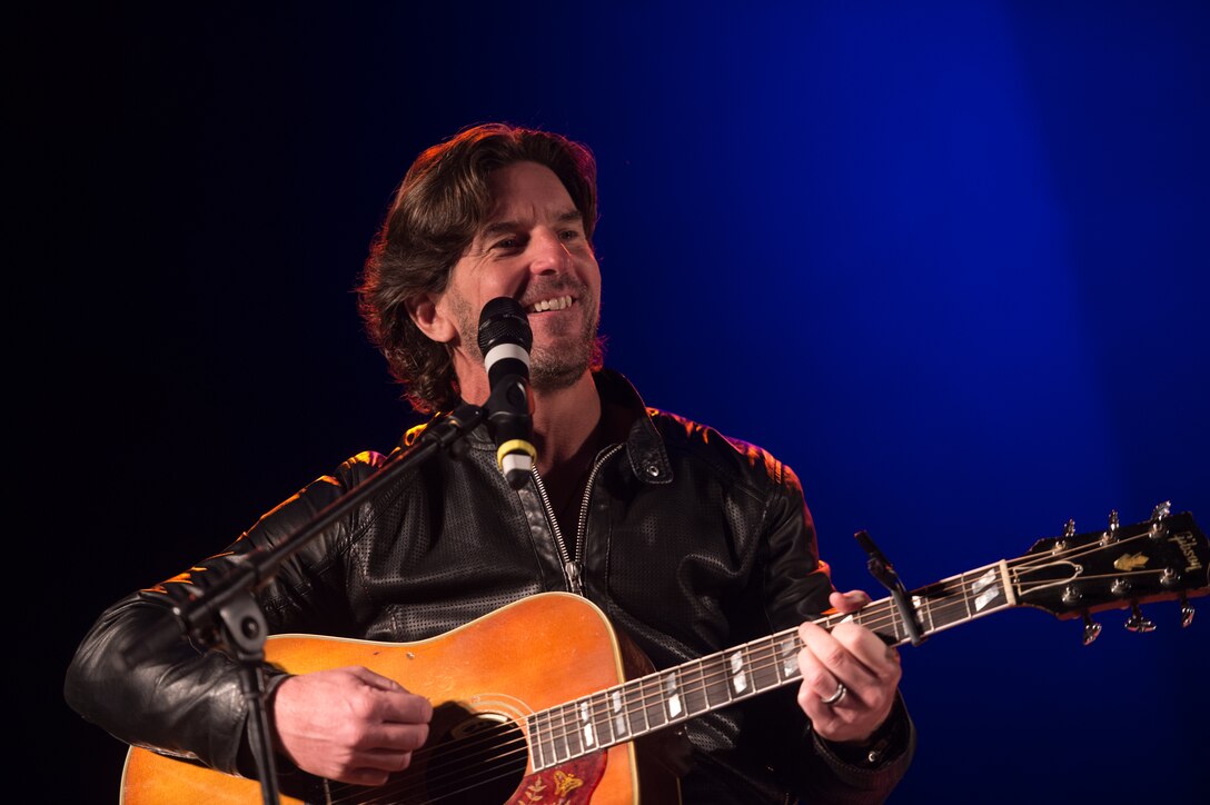 Songwriter Brett James performs in a USO show for military members and their families at Ramstein Air Base, Germany, Dec. 9, 2015. Entertainers with the 2015 USO Holiday Tour traveled to various locations to visit service members deployed overseas. DoD photo by D. Myles Cullen