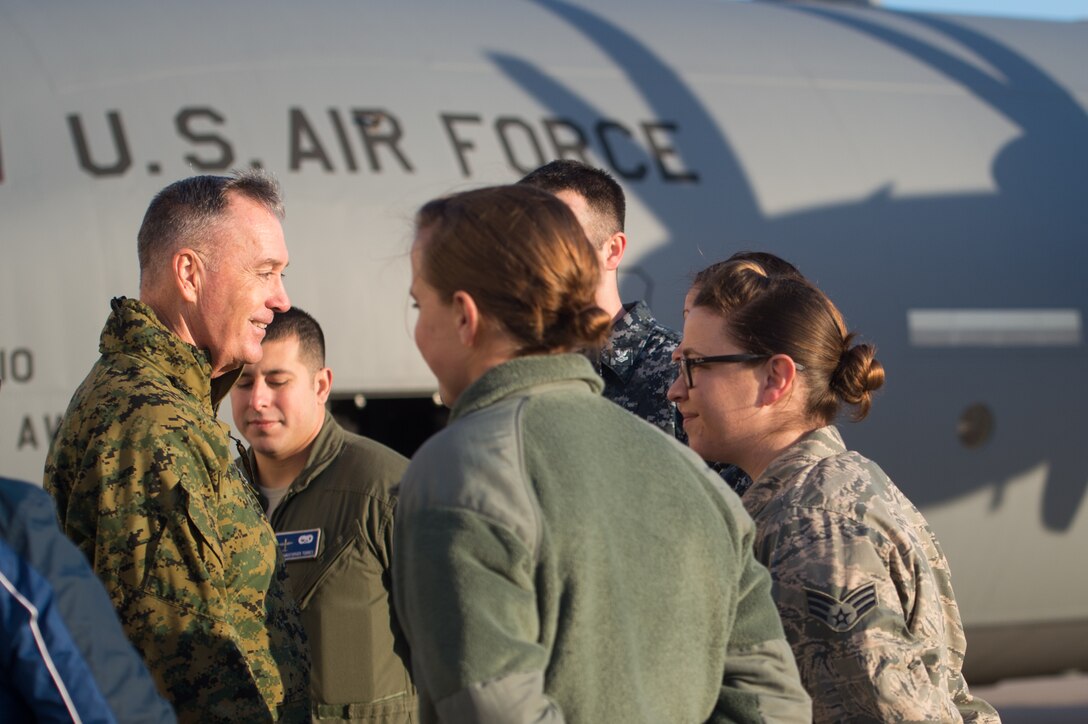 U.S. Marine Gen. Joseph F. Dunford Jr., chairman of the Joint Chiefs of Staff, talks with airmen stationed at Ramstein Air Base, Germany, Dec. 9, 2015.  Dunford and entertainers with the 2015 USO Holiday Tour traveled to various locations to visit service members deployed overseas. DoD photo by D. Myles Cullen
