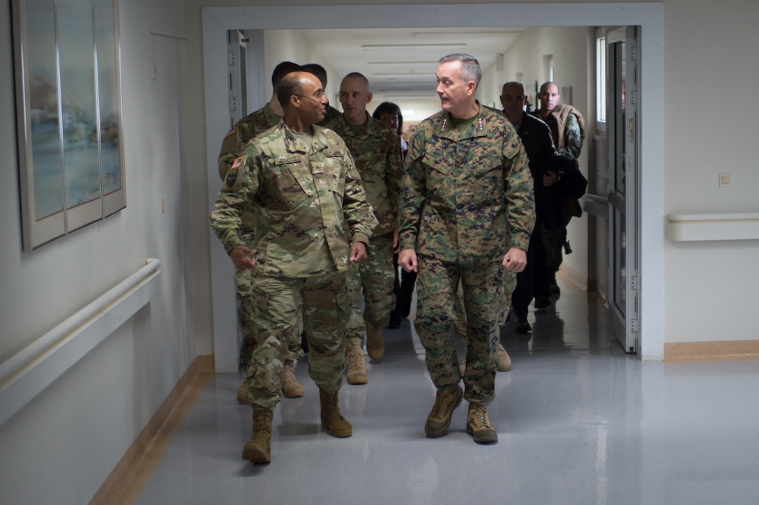 U.S. Marine Corps Gen. Joseph F. Dunford Jr., chairman of the Joint Chiefs of Staff and Brig. Gen. Norvell V. Coots, commander of Europe Regional Medical Command,  tour Landstuhl Regional Medical Center, Germany, Dec. 9, 2015. DoD photo by D. Myles Cullen