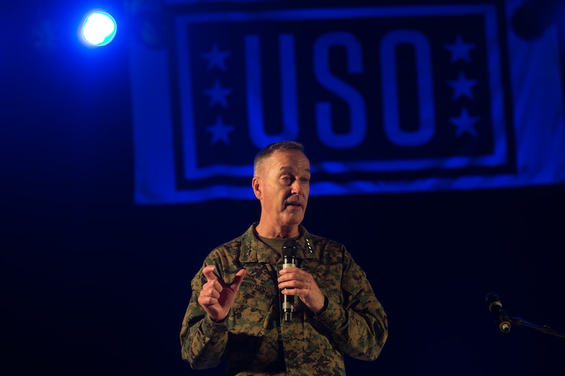 U.S. Marine Corps Gen. Joseph F. Dunford Jr., chairman of the Joint Chiefs of Staff, talks with service members and their families before the start of a USO show on Ramstein Air Base, Germany, Dec. 9, 2015. Dunford and entertainers with the 2015 USO Holiday Tour traveled to various locations to visit service members deployed overseas. DoD photo by D. Myles Cullen