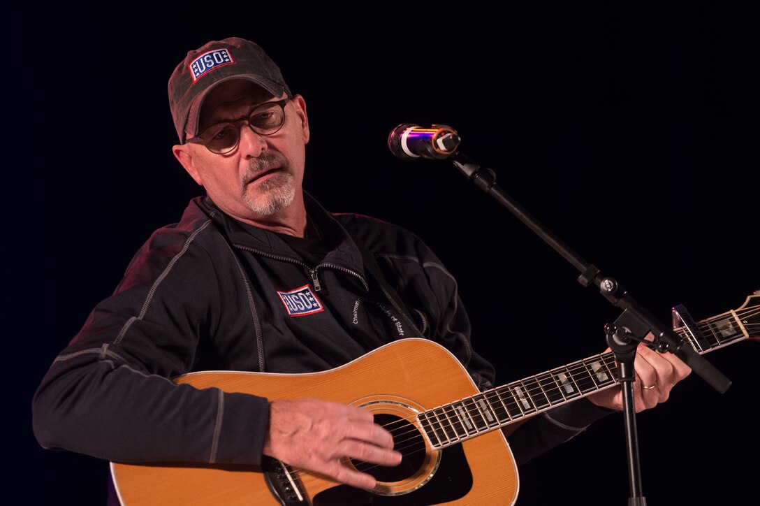 Billy Montana performs in a USO show for military members and their families at Ramstein Air Base, Germany, Dec. 9, 2015. Entertainers with the 2015 USO Holiday Tour traveled to various locations to visit service members deployed overseas. DoD photo by D. Myles Cullen