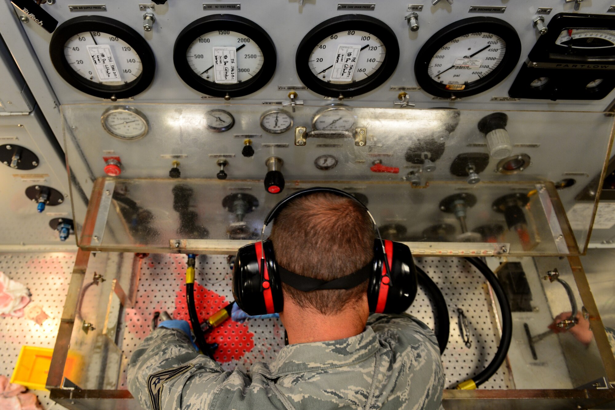 Tech. Sgt. Theodore Kolffvanoosterwyk, 2nd Maintenance Operation Squadron hydraulics systems craftsman, tests the integrity of hydraulic valves at Barksdale Air Force Base, La., Dec. 4, 2015. The valves are essential parts of hydraulic systems which control brakes, landing gear and spoilers on the B-52 stratofortress. (U.S. Air Force photo/Airman 1st Class Luke Hill)