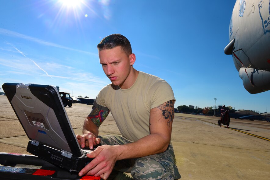 Airman 1st Class Jory Billings, 2nd Maintenance Squadron hydraulic systems apprentice, reviews instructions for testing the hydraulic system of a B-52 Stratofortress at Barksdale Air Force Base, La., Dec. 8, 2015. Hydraulic specialists are responsible for maintaining systems which assist with steering, landing and opening of the bomb bay doors. (U.S. Air Force photo/Airman 1st Class Luke Hill)