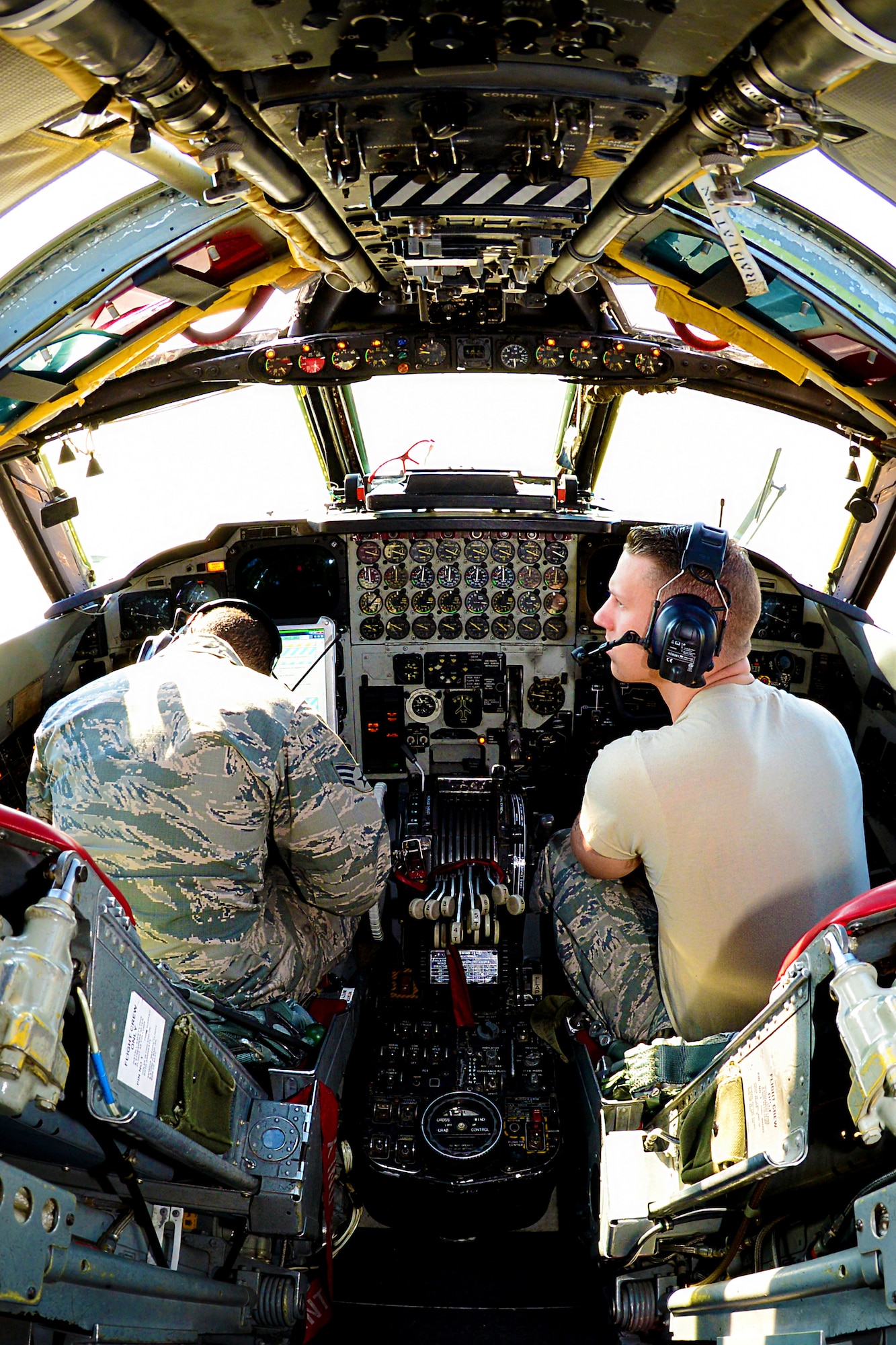 Senior Airman Jeffrey Valentin, left, and Airman 1st Class Jory Billings, 2nd Maintenance Squadron hydraulic systems Airmen, look over a technical order at Barksdale Air Force Base, La., Dec. 8, 2015. TO’s are step-by-step instruction manuals used by maintenance Airmen that list proper tools needed, any hazards to be aware of and protective gear to accomplish the task. (U.S. Air Force photo/Airman 1st Class Luke Hill)