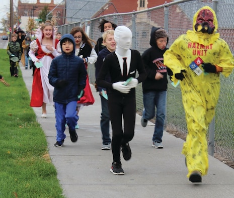Students at Hacker Middle School in Mountain Home, Idaho, participate in a “walk-a-thon” Oct. 30, 2015. The event was supported by volunteers through the School Advisory Committee and helped purchase Chromebooks for 20 Hacker classrooms. Twenty-two SAC volunteers and hundreds of students walked 1,744 miles and raised almost $9,000 for the computers. (Courtesy photo by Mountain Home News)