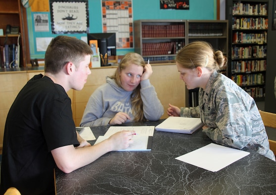 Volunteers from Mountain Home Air Force Base tutor a student at Mountain Home High School, Idaho, Nov. 18, 2015. Weekly tutors are one of many volunteer opportunities the School Advisory Committee helps coordinate. (Courtesy photo by Master Sgt. Ann Mitchell)