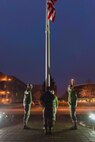 Members of the 27 Aerial Port participate in a flag raising ceremony, Dec. 6 at Minneapolis-St. Paul International Airport Air Reserve Station, Minn. (U.S. Air Force photo by Staff Sgt. Trevor Saylor)

