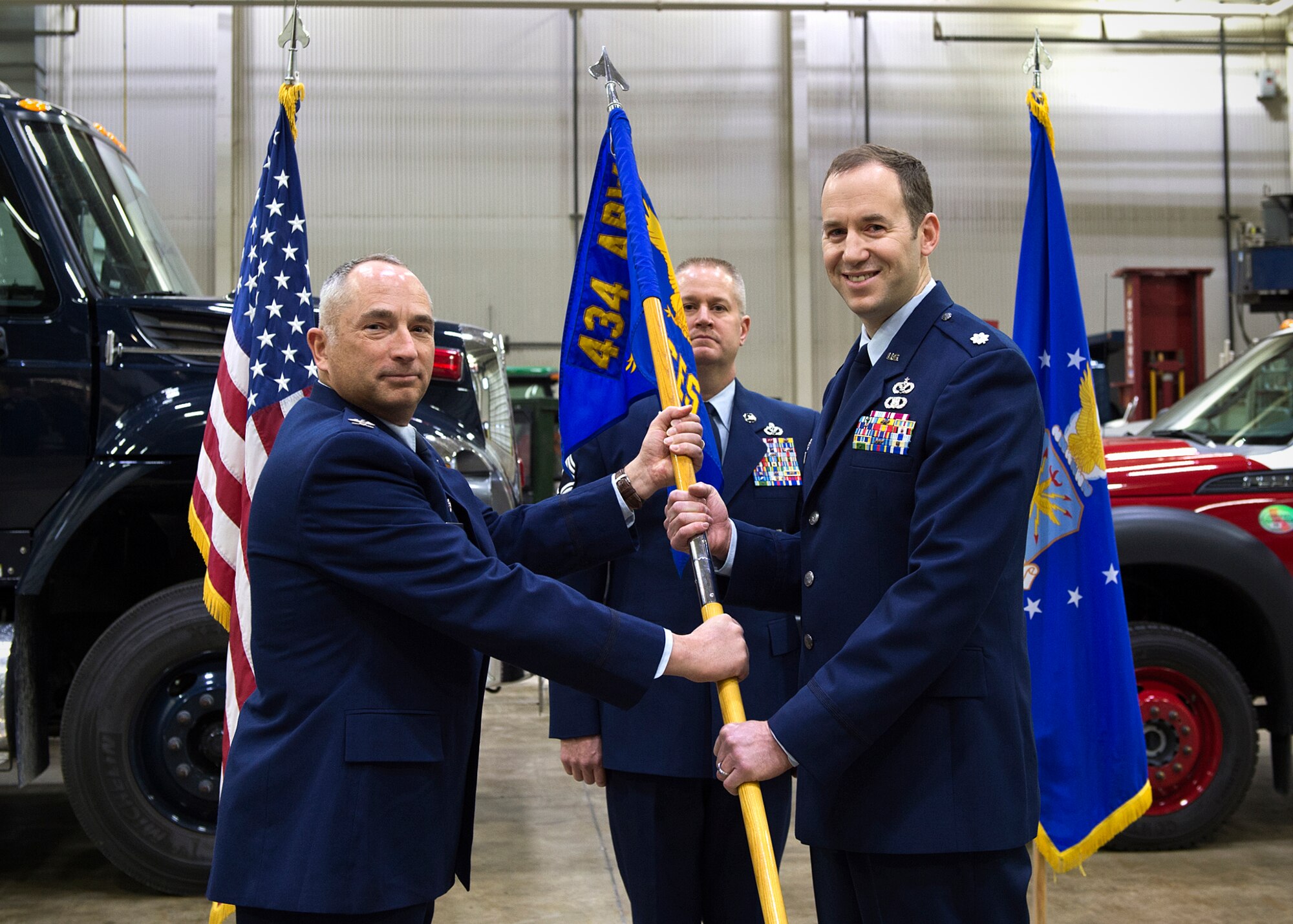 Lt. Col. James Ballas, right, accepts command of the 434th Civil Engineer Squadron from Col. Scott Russell, 434th Mission Support Group commander, during a change of command ceremony at Grissom Air Reserve Base, Ind., Dec. 5, 2015. Ballas replaced outgoing commander, Lt. Col. Paul Brenner during the ceremony. (U.S. Air Force photo/Senior Airman Katrina Heikkinen)