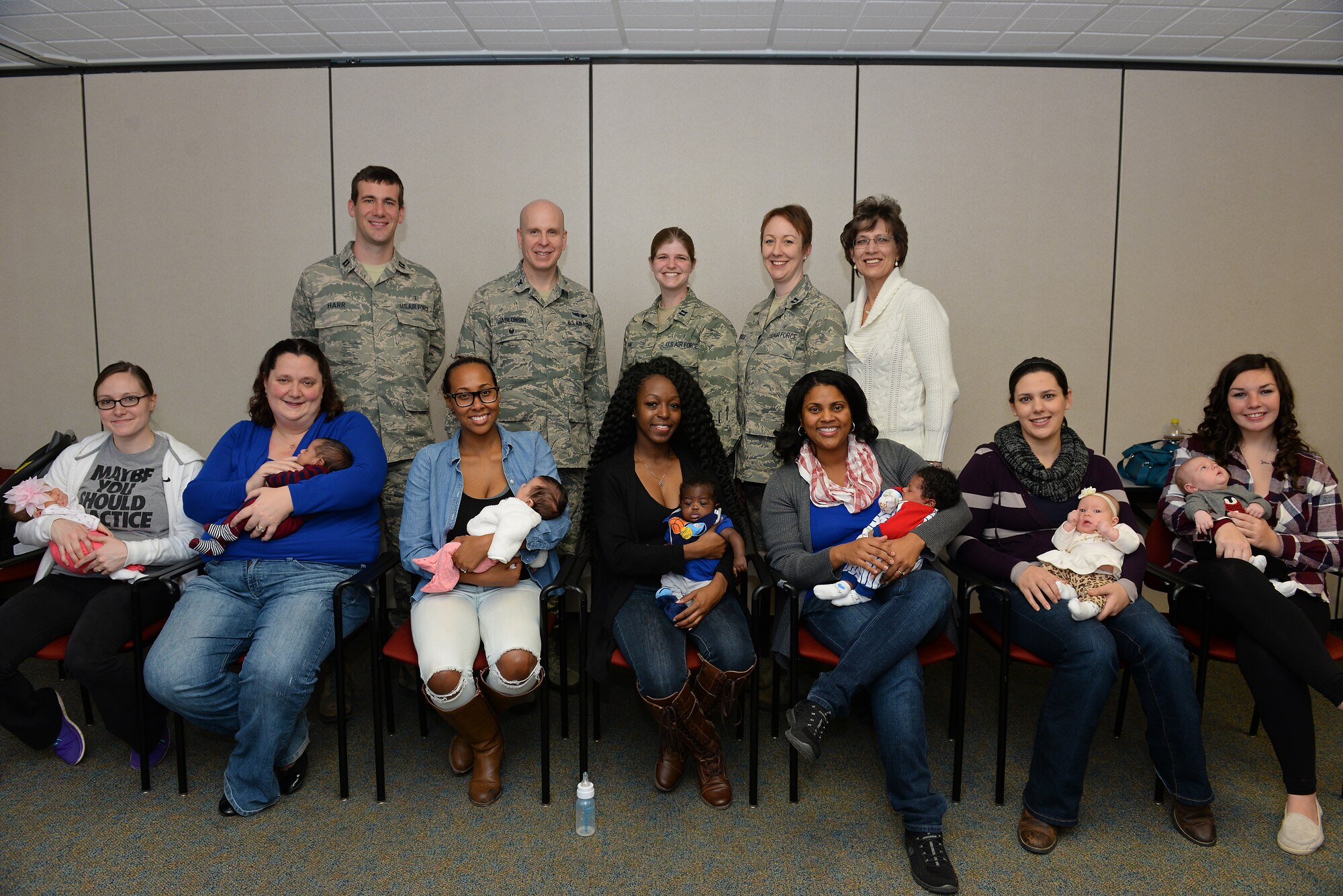 New moms who participated in a Centering Pregnancy support group gathered for a reunion along with family medicine physicians who either facilitated the group or delivered their babies, Dec. 1, 2015, Belleville, Illinois. The support group came together to celebrate the birth of their children and discuss how the group helped them prepare for labor and the first weeks of their children's lives. (U.S. Air Force photo by Airman 1st Class Erica Holbert-Siebert)