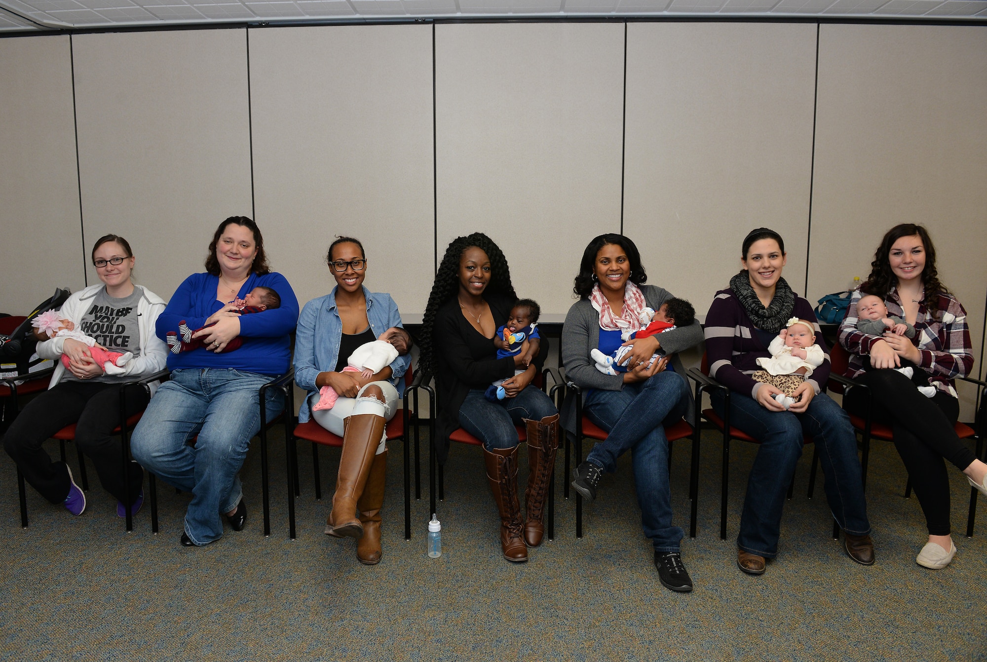 New moms who participated in a Centering Pregnancy support group gathered for a reunion, Dec. 1, 2015, Belleville, Illinois. The support group came together to celebrate the birth of their children and discuss how the group helped them prepare for labor and the first weeks of their children's lives. (U.S. Air Force photo by Airman 1st Class Erica Holbert-Siebert)