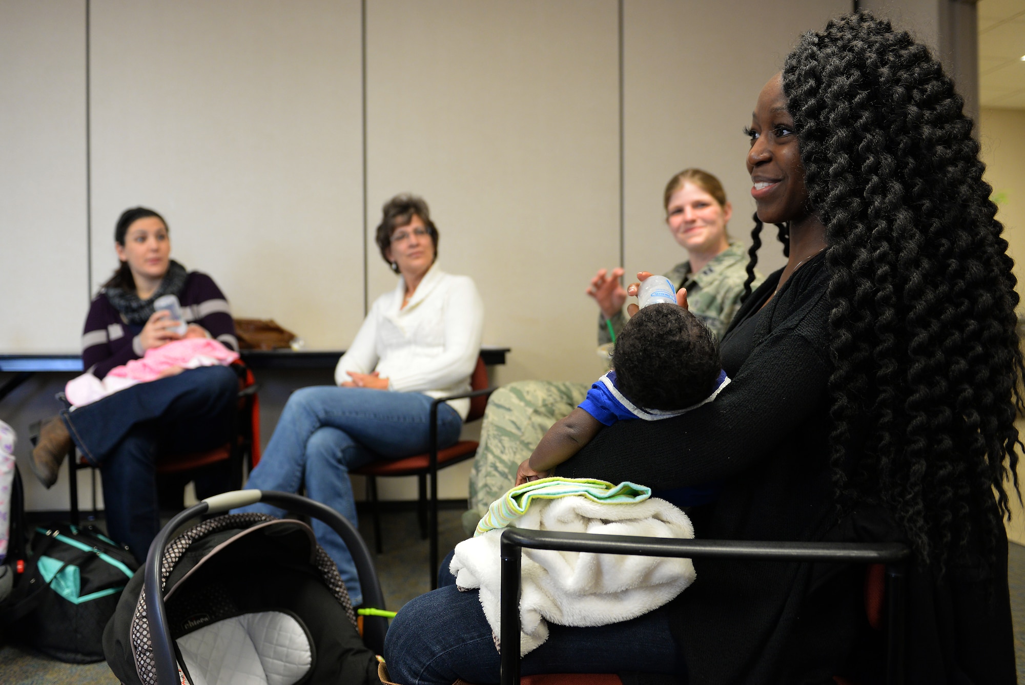 A new mom talks about what she liked about the Centering Pregnancy support group during a reunion, Dec. 1, 2015, Belleville, Illinois. The support group reunited to celebrate the birth of their children and discuss how the group helped them prepare for labor and the first weeks of their children's lives. (U.S. Air Force photo by Airman 1st Class Erica Holbert-Siebert)