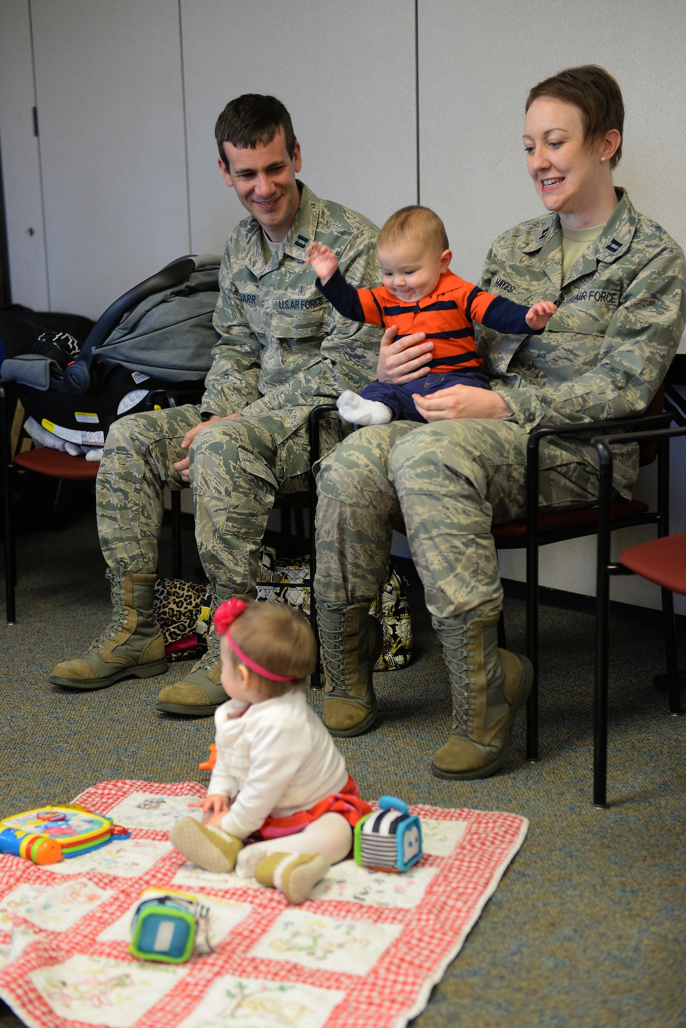 Family medicine physicians discuss raising young children during a Centering Pregnancy support group reunion, Dec. 1, 2015, Belleville, Illinois. The support group reunited to celebrate the birth of their children and discuss how the group helped them prepare for labor and the first weeks of their children's lives. (U.S. Air Force photo by Airman 1st Class Erica Holbert-Siebert)