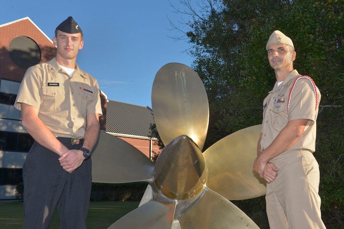 (From left to right) Petty Officer 3rd Class Rylee Schaefer, Navy Nuclear Power Training Command electronics technician graduate, stands with MCPO Paul Karrow, NNPTC Indoctrination Coordinator, outside the NNPTC school at Joint Base Charleston – Naval Weapons Station, S.C., on Dec. 7, 2015. The NNPTC moved from the Naval Training Center in Orlando, FL. to the Naval Weapons Station in 1998. (U.S. Air Force photo/Airman 1st Class Thomas T. Charlton)