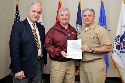 (left to right) Steve Price and Bob Walker, representatives of Trident Technical Institute pose for a photo with Capt. Timothy Sparks, Joint Base Charleston deputy commander, during an Air Force Partnership Program (P4) meeting at Joint Base Charleston - Air Base, S.C., Dec. 4, 2015. During the meeting, the first initiative was signed into policy--a partnership with Trident Technical College for sharing the motorcycle safety courses and instructors in exchange for help maintaining the motorcycles the base owns and operates. (U.S. Air Force photo/Tech. Sgt. Renae Pittman)