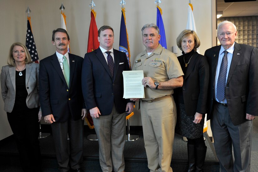 (left to right) Rita Berry, Summerville chamber of commerce, Rick Mahon, Ralph H. Johnson VA Medical Center Charleston, Jake Broom, representative of the city of Goose Creek, Capt. Timothy Sparks, Joint Base Charleston deputy commander, Mary Graham, Charleston chamber of commerce and North Charleston Councilman Bob King pose for a photo after signing the Air Force Partnership Program charter during a meeting at Joint Base Charleston - Air Base, S.C., Dec 4, 2015. The meeting was significant for two reasons: first, to sign a charter solidifying the partnerships between local leaders and the military base and second, to sign the first initiative proposal making it policy. (U.S. Air Force photo/Tech. Sgt. Renae Pittman)