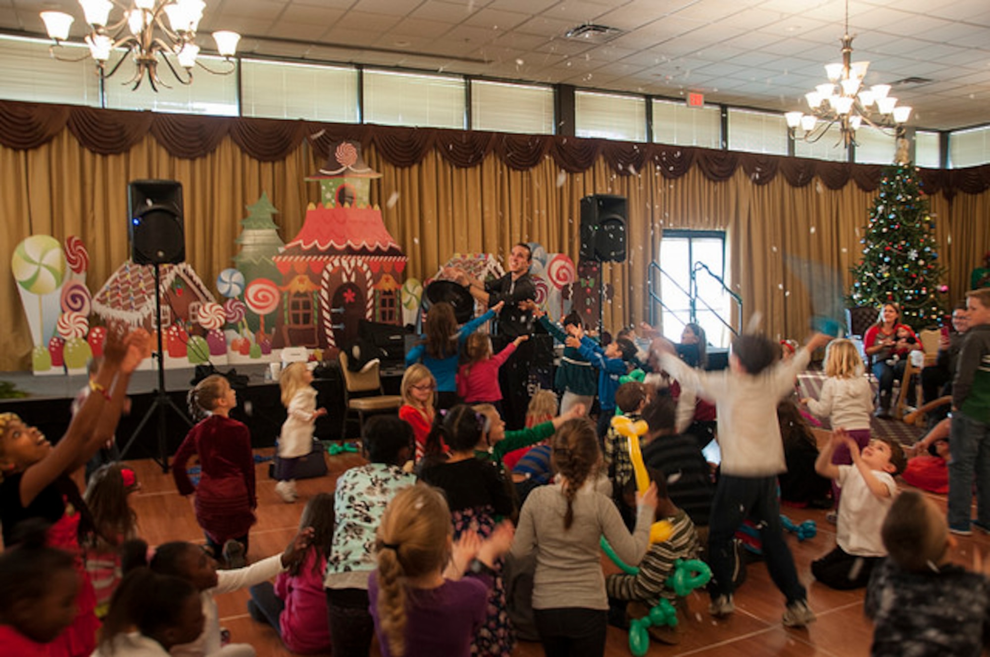 Children react to a magic trick at the 2015 Hearts Apart Holiday Party at Tommy B's Community Activities Center here, Dec. 6. The annual party celebrates the families who experienced deployments or extended time apart   during the year.  (U.S. Air Force photo/Senior Airman Lauren Pitts)