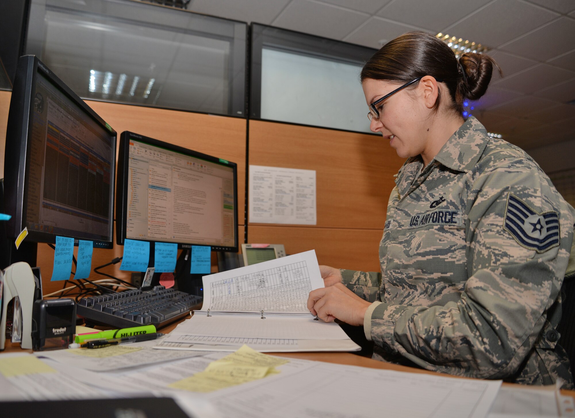 U.S. Air Force Tech. Sgt. Kimberly Leonard, 351st Air Refueling Squadron Aviation Resource Management NCO in charge, reviews flight records, Dec. 8, 2015, on RAF Mildenhall, England. Leonard was selected for the Square D Spotlight for portraying the core value of Service Before Self. (U.S. Air Force photo by Senior Airman Christine Halan/Released) 