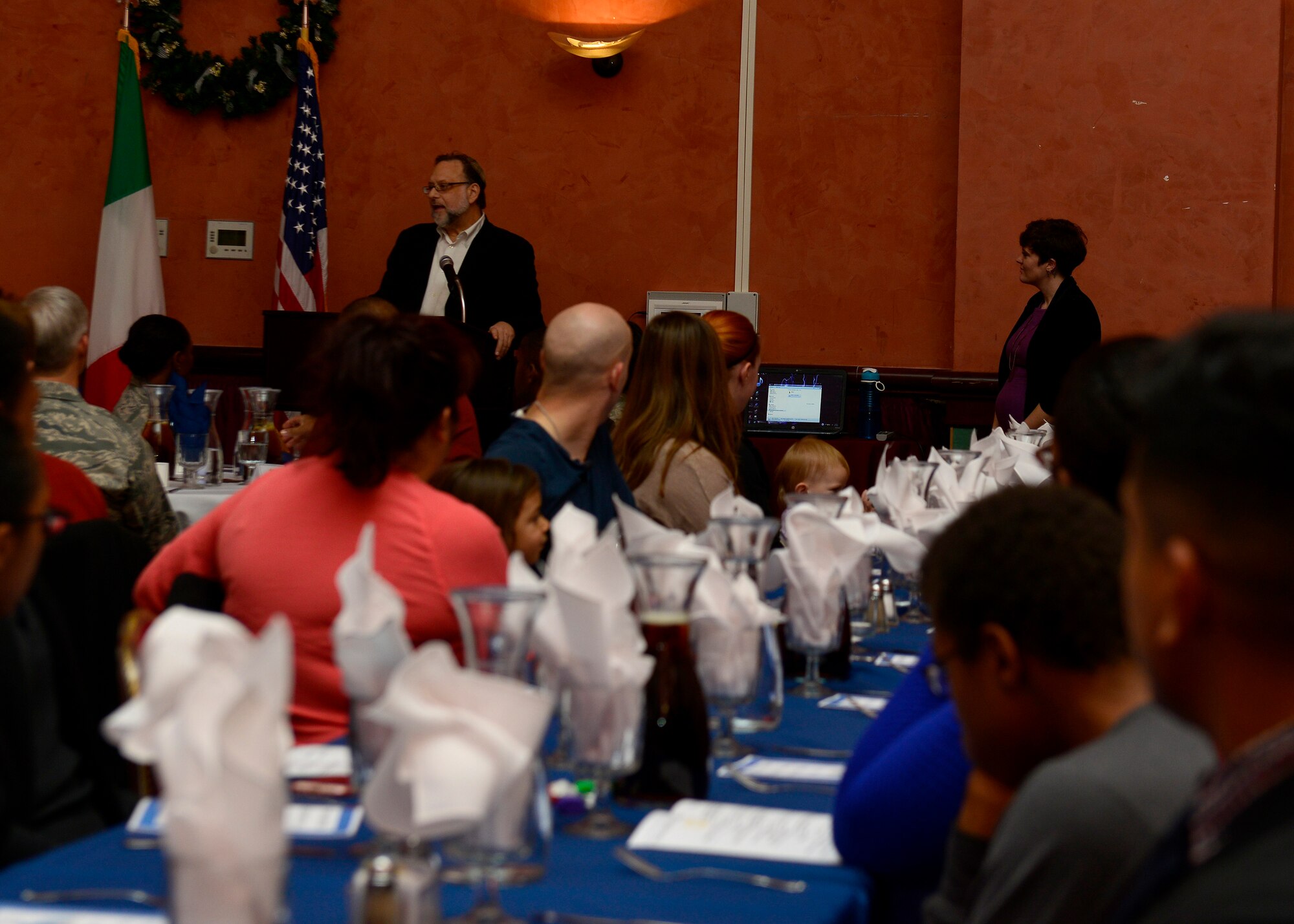 Rabbi Zev Shwatz speaks to attendees during an inter-faith Hanukkah celebration, Dec. 8, 2015, at Aviano Air Base, Italy. The Menorah lighting was followed by dinner, prayer and scripture readings. (U.S. Air Force photo by Airman 1st Class Cary Smith/Released)
