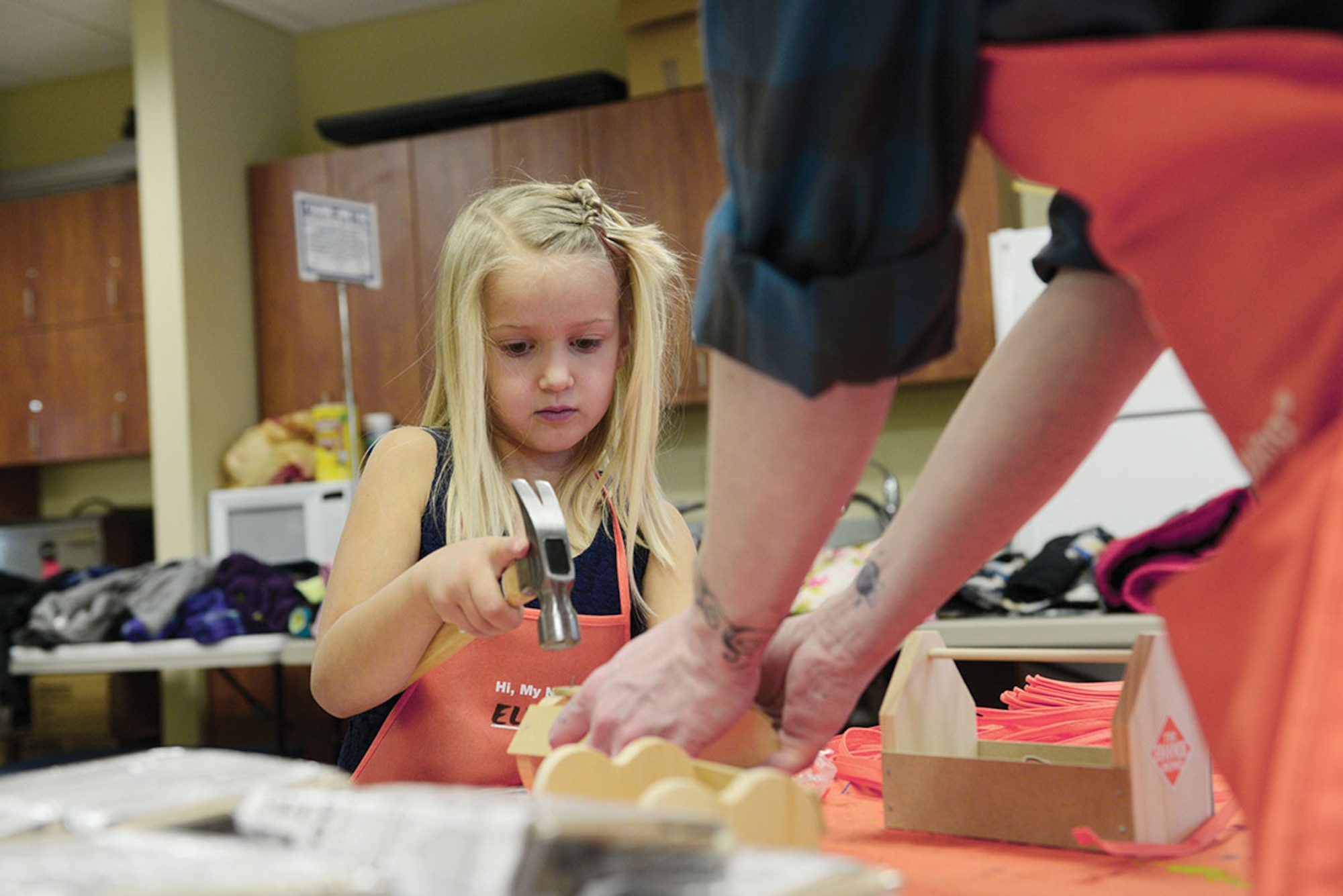 Ellie Hamblin, 6, builds a tool box during Operation Homefront’s holiday toy drive. Holiday gifts were distributed to junior enlisted family members to show appreciation and enhance junior enlisted families holidays. Ellie is the daughter of Staff Sgt. Daniel Hamblin, with the 962nd Airborne Air Control Squadron, and Sara Hamblin. (U.S. Air Force photo/Airman Valerie Monroy)