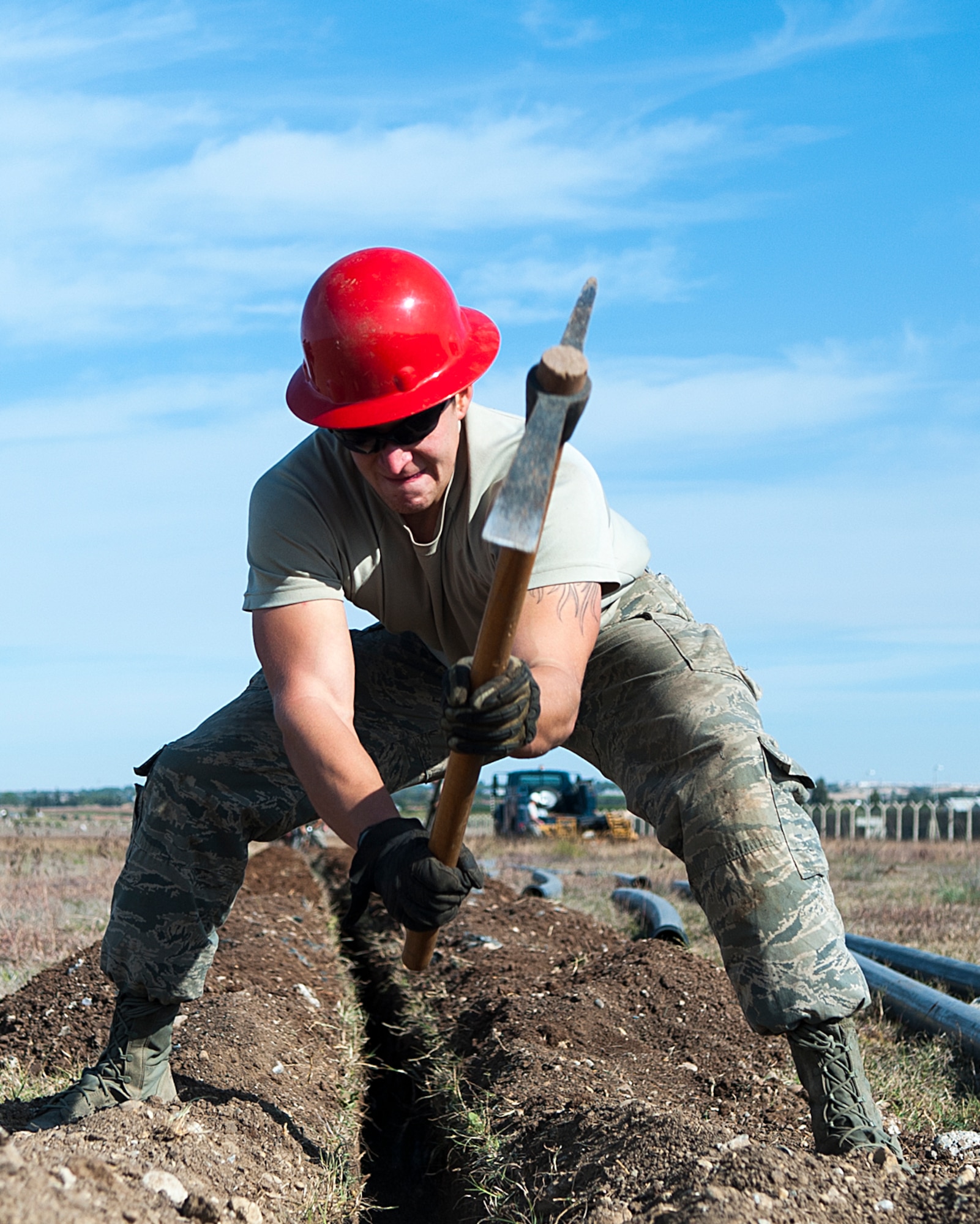 Airman 1st Class Trevor Hermosillo, 39th Communications Squadron cable and antenna technician, unearths rocks while preparing to install underground communication lines Nov. 18, 2015, at Incirlik Air Base, Turkey. Laying communication cable is the first of many steps to establishing communications infrastructure. The CS works to establish and maintain new and old infrastructure to ensure Incirlik, and Operation Inherent Resolve, missions are accomplished. (U.S. Air Force photo by Staff Sgt. Jack Sanders/Released)