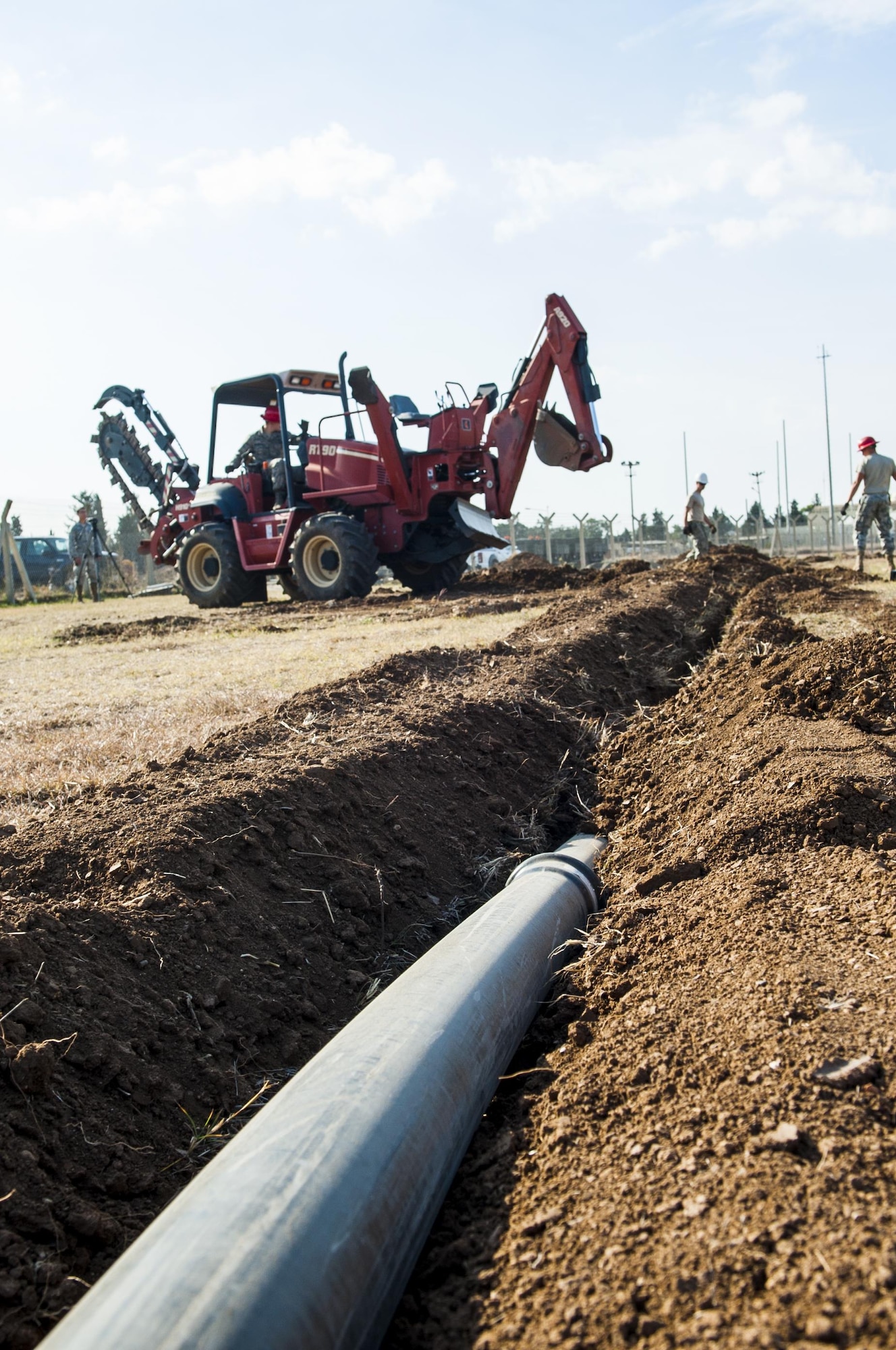 Airmen from the 39th Communications Squadron install underground communications lines, the framework for commuication infrastructure Nov. 18, 2015, at Incirlik Air Base, Turkey. The underground communication cable is the first of many steps to establishing a communications infrastructure. The CS works to establish and maintain new and old infrastructure to ensure Incirlik, and Operation Inherent Resolve, missions are accomplished.  (U.S. Air Force photo by Staff Sgt. Jack Sanders/Released)