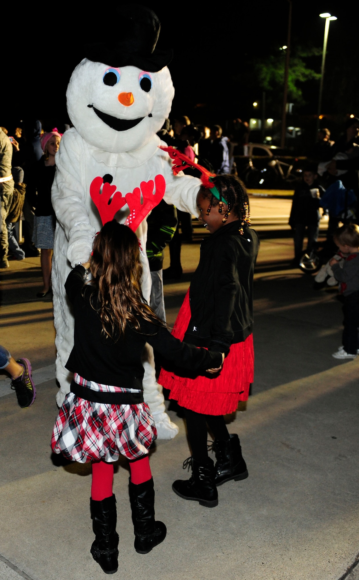 Children from ‘Team Incirlik’ play with Frosty the Snowman during the 2015 Incirlik Holiday Tree Lighting ceremony Dec. 1, 2015, at Incirlik Air Base, Turkey. The tree lighting included free hot chocolate and cookies, caroling and an opportunity for families to take photos with Santa Claus. (U.S. Air Force photos by Senior Airman Krystal Ardrey/Released)