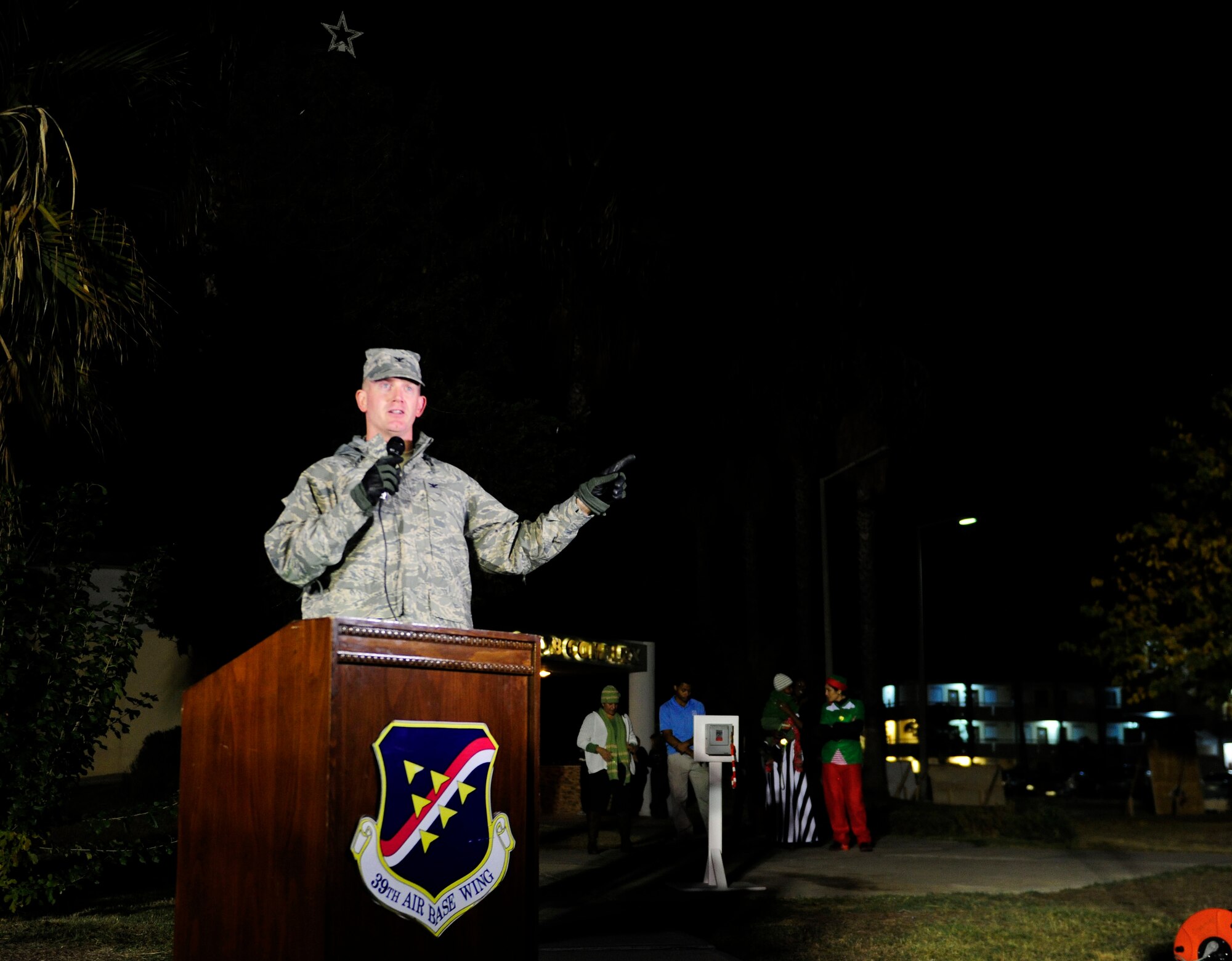 Col. John Walker, 39th Air Base Wing commander, gives opening remarks during the 2015 Incirlik Holiday Tree Lighting ceremony Dec. 1, 2015, at Incirlik Air Base, Turkey. Events of the tree lighting included a speech from Col. John Walker, 39th Air Base Wing commander, a visit from Santa Claus and the singing of holiday carols. (U.S. Air Force photos by Senior Airman Krystal Ardrey/Released)