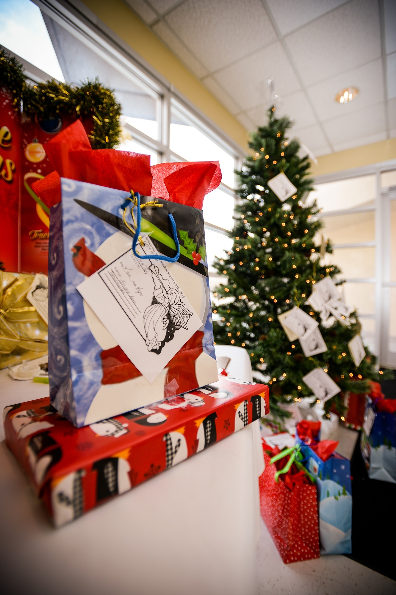 An Angel Tree gift sits atop a table in the foyer of the Hill Air Force Base Chapel, Dec. 3. Over 600 donations were placed under the tree this year. (U.S. Air Force photo by R. Nial Bradshaw)