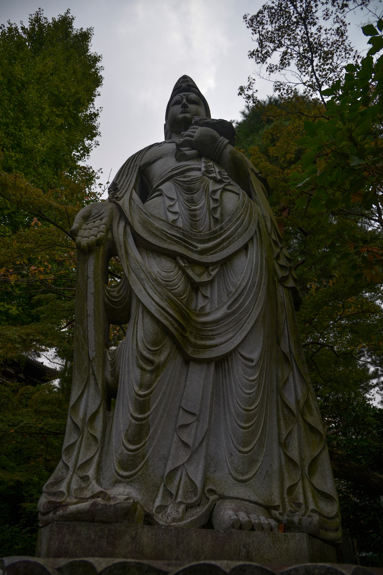 A Buddhist statue sits at the beginning of a hiking trail at the Takahata Fudo Temple grounds in Hino City, Japan, Nov. 1, 2015. There are 88 Buddhist statues along the trail that lead to an observation point and the Daishido Temple. (U.S. Air Force photo by Senior Airman David Owsianka/Released)