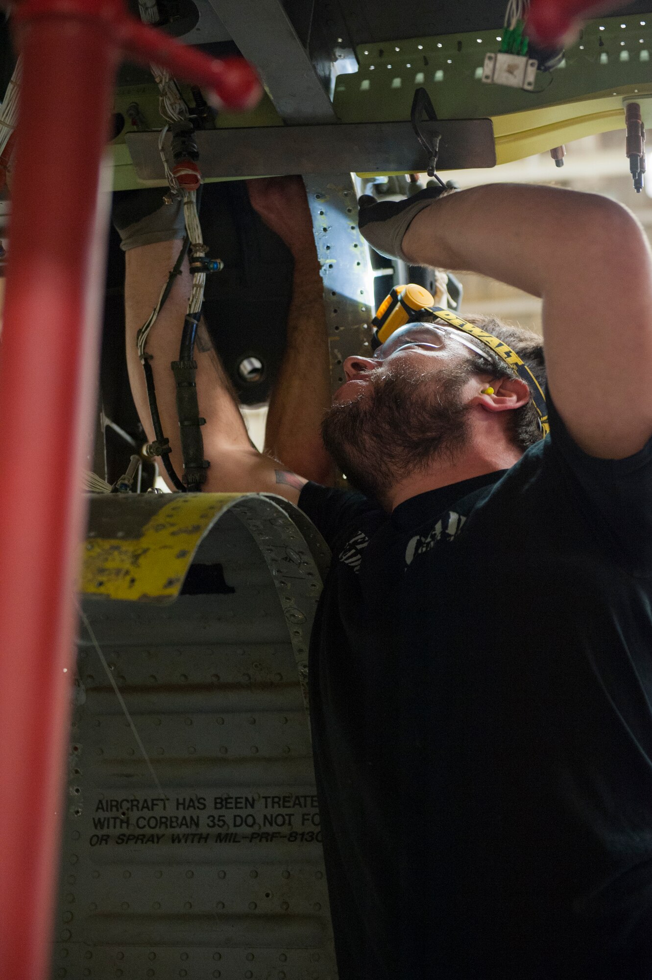Jeffrey Coronado, Corpus Christi Texas Army Depot Field team member, begins repairs on a main structural beam for the HH-60G Pave hawk during a phase inspection Dec. 10, 2015, at Kadena Air Base, Japan. The phase inspection occurs every 600 flight hours. This repair is to ensure the structural integrity and safety of the helicopter. (U.S. Air Force photo by Airman Zackary A. Henry)