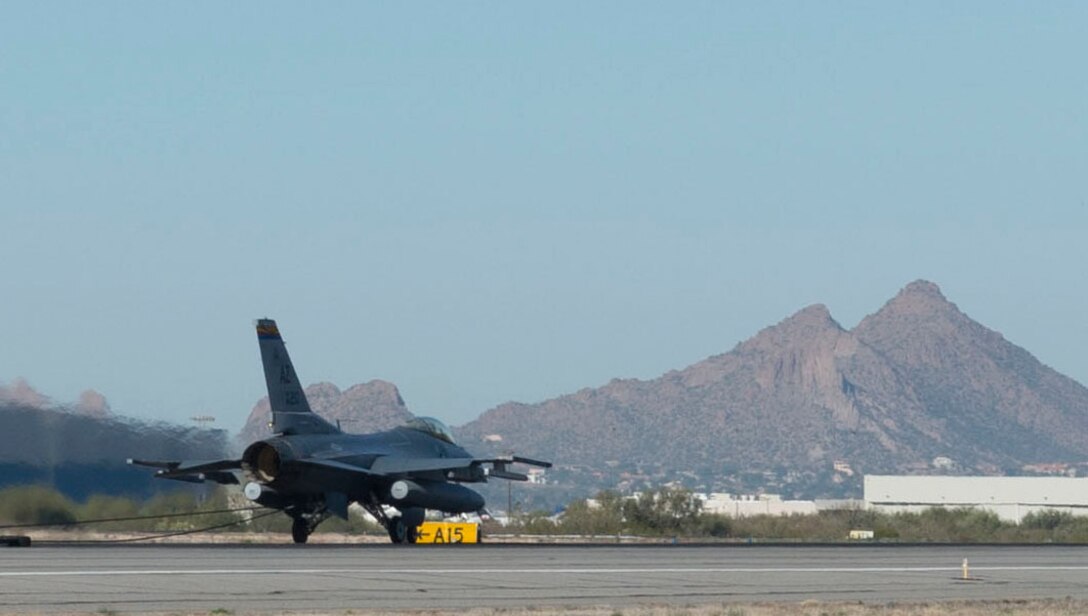 An Arizona Air National Guard F-16 Fighting Falcon catches the barrier cable during a test performed Dec 5, 2015 at the Tucson International Airport. The 162nd Wing performs certification exercises annually to ensure the equipment is ready to prevent a crash and save lives. (U.S. Air National Guard Photo by Staff Sgt. Gregory Ferreira/ Released)