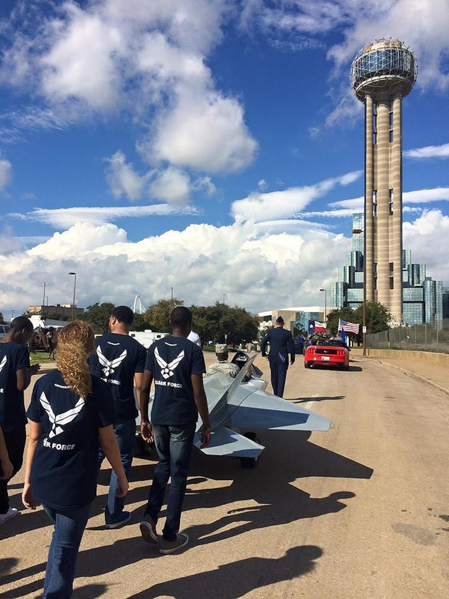Staff Sgts. Kevin Schroeder and Timothy Crowsey of the 344th Recruiting Squadron lead Delayed Entry Program members along the two-mile-long route near Reunion Tower in Dallas, Nov. 11, 2015. Members of the 344th RCS A-Flight and their DEP participated in the annual Dallas Veterans Day Parade. (U.S. Air Force photo)