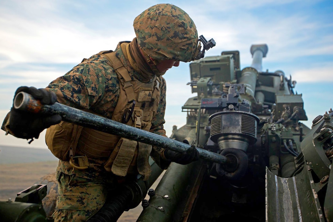 A U.S. Marine participates in artillery live-fire rehearsals during Platinum Lynx 16-2 on Smardan Training Area, Romania, Dec. 8, 2015. Exercise Platinum Lynx 16-2 is a NATO-led multinational exercise designed to strengthen combat readiness, increase collective capabilities and maintain proven relationships with allied and partner nations. U.S. Marine Corps photo by Lance Cpl. Melanye E. Martinez
