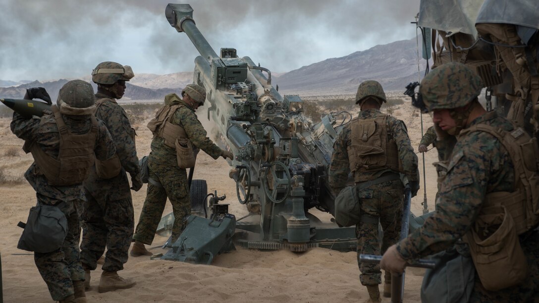 Marines with Battery I, 3rd Battalion, 11th Marine Regiment, 1st Marine Division, fire an M777 Howitzer¬ during the opening day of live-fire operations for Steel Knight at Marine Corps Air Ground Combat Center Twentynine Palms, Calif., on Dec. 10, 2015. The tough, realistic training is intended to develop combat skills necessary to operate as the ground combat element of the I Marine Expeditionary Force.