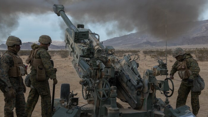 Marines with Battery I, 3rd Battalion, 11th Marine Regiment, 1st Marine Division, fire an M777 Howitzer¬ during the opening day of live-fire operations for Steel Knight at Marine Corps Air Ground Combat Center Twentynine Palms, California, on Dec. 10, 2015. The tough, realistic training is intended to develop combat skills necessary to operate as the ground combat element of the I Marine Expeditionary Force.